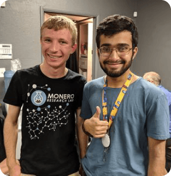 Rasikh Morani with a member of the Monero Research Lab