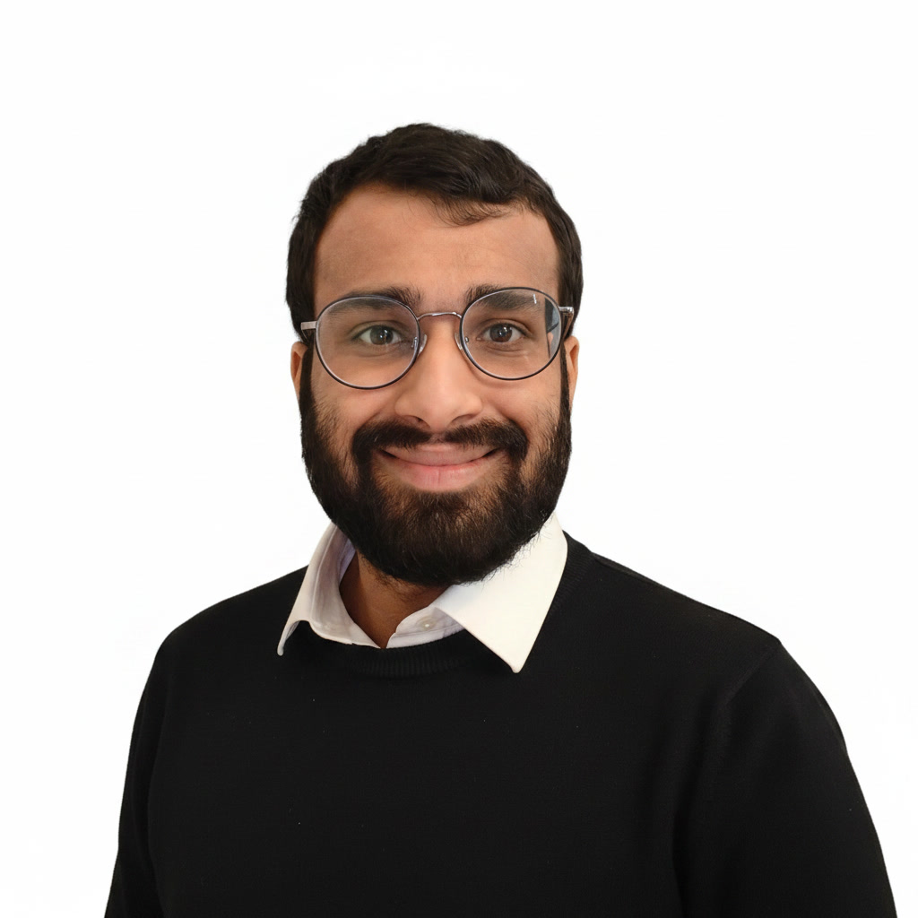 Portrait of Rasikh Morani wearing a black sweater